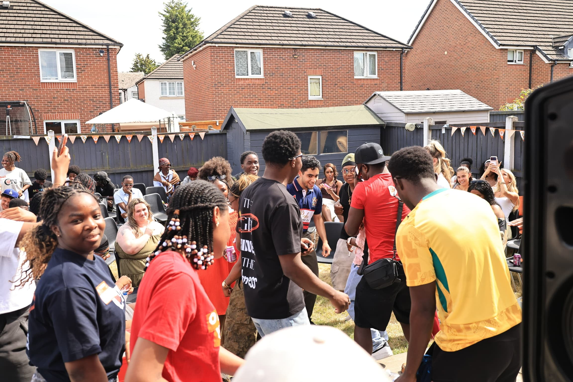 The church family gathered outdoors at a community event
