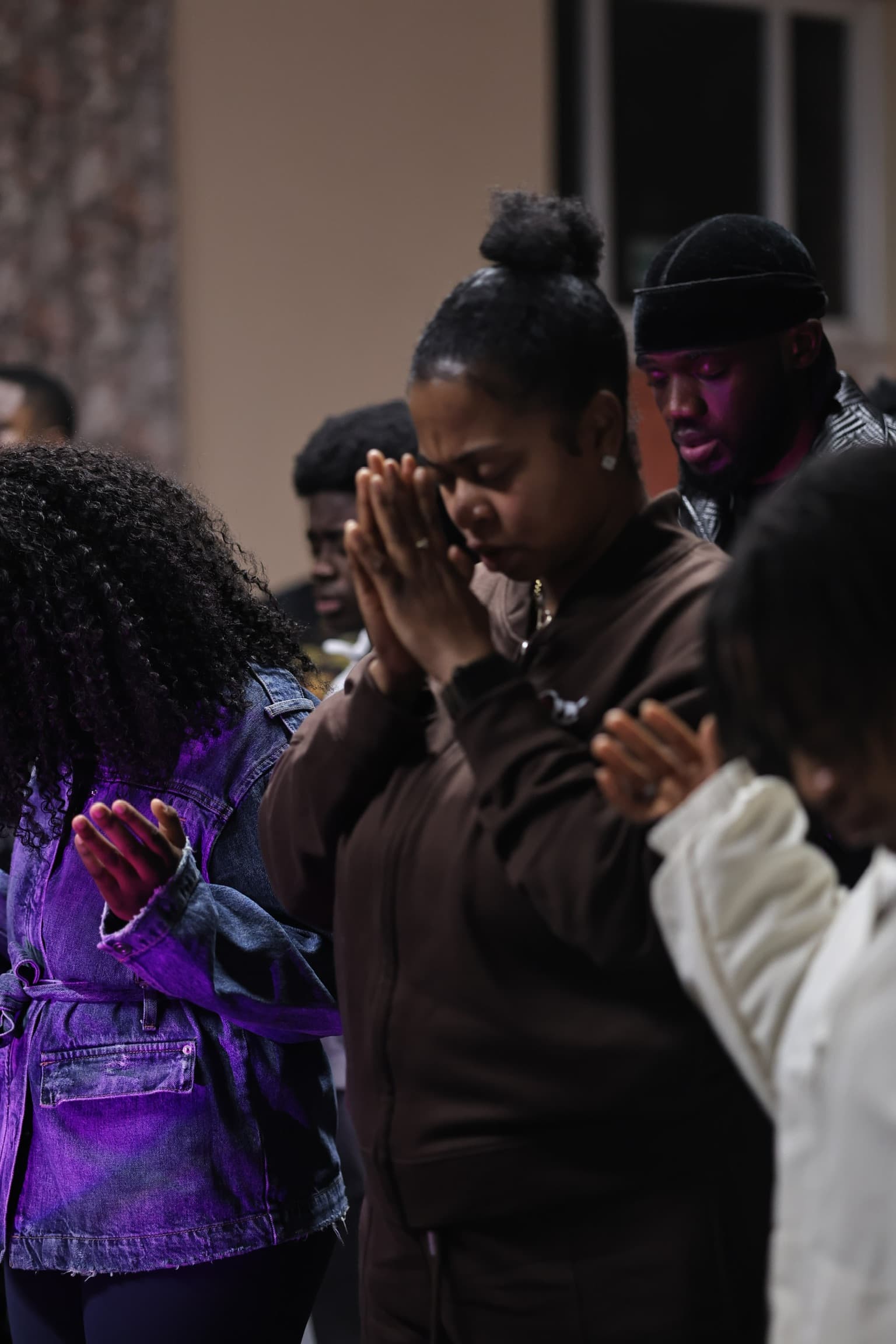 The congregation worshipping together with hands raised